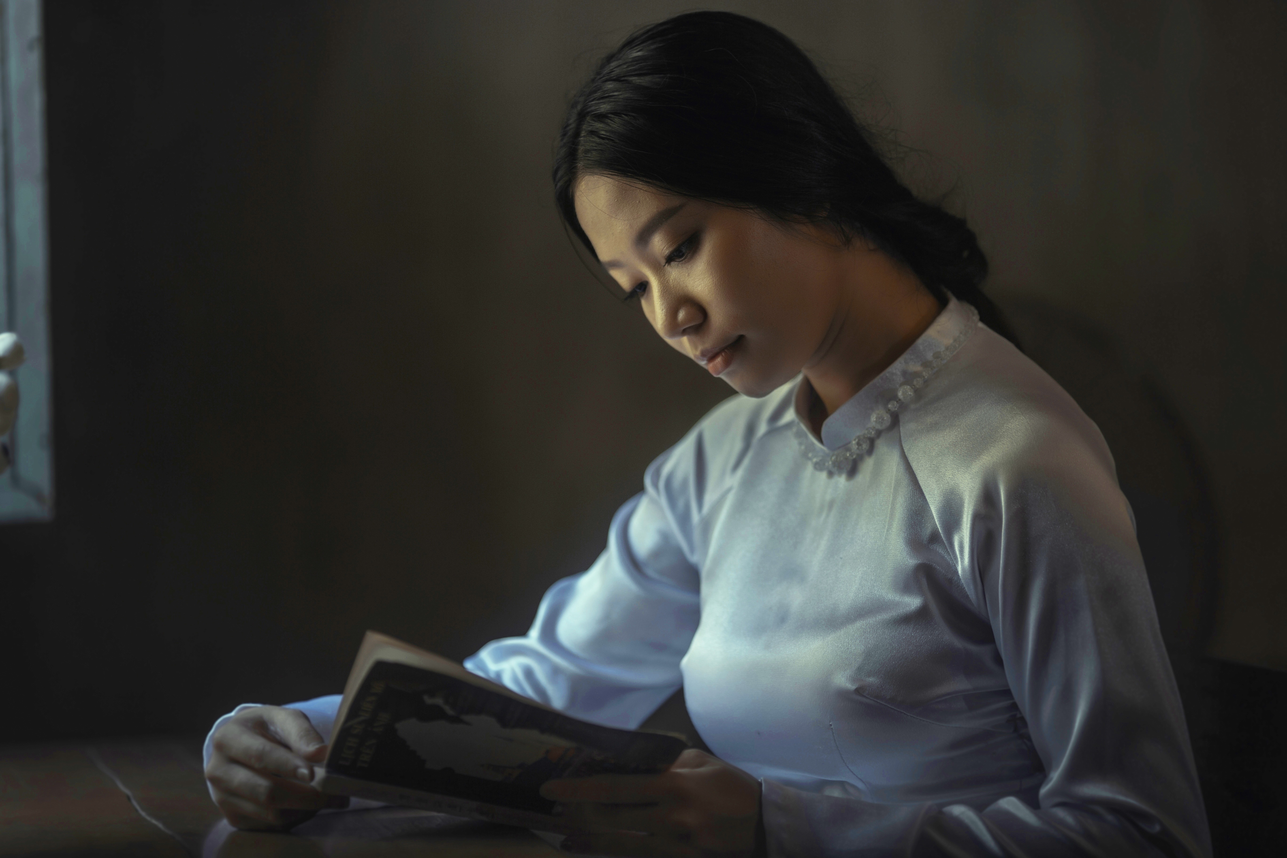 Asian woman reading